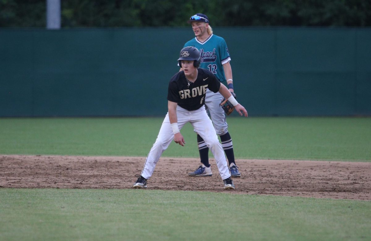 In round two of the playoffs against Carrollton, Jace Elrod (10) leads off to steal third base. 