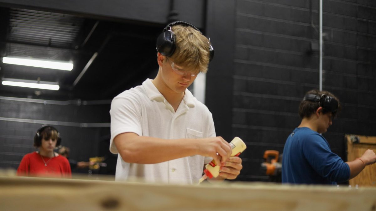 Putting a set piece together, Buxton Mathis (11) works in the new theatr scene shop.